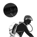 Person wearing a backpack with a helmet on their head, showing the interior of the backpack.